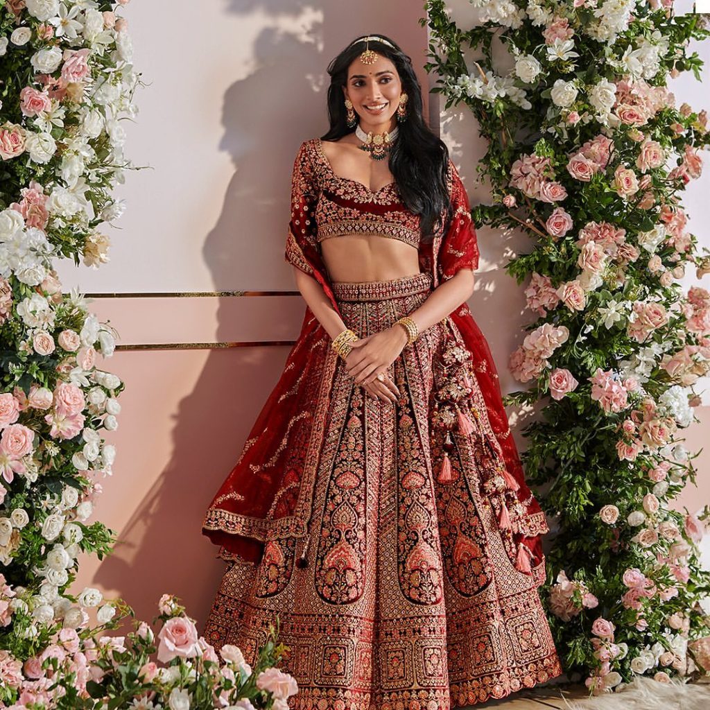a beautiful women in an Indian wedding dress called lehenga