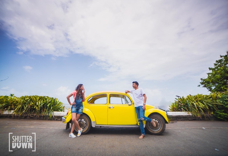 Indian couple posing around a sports car | Photo 270251